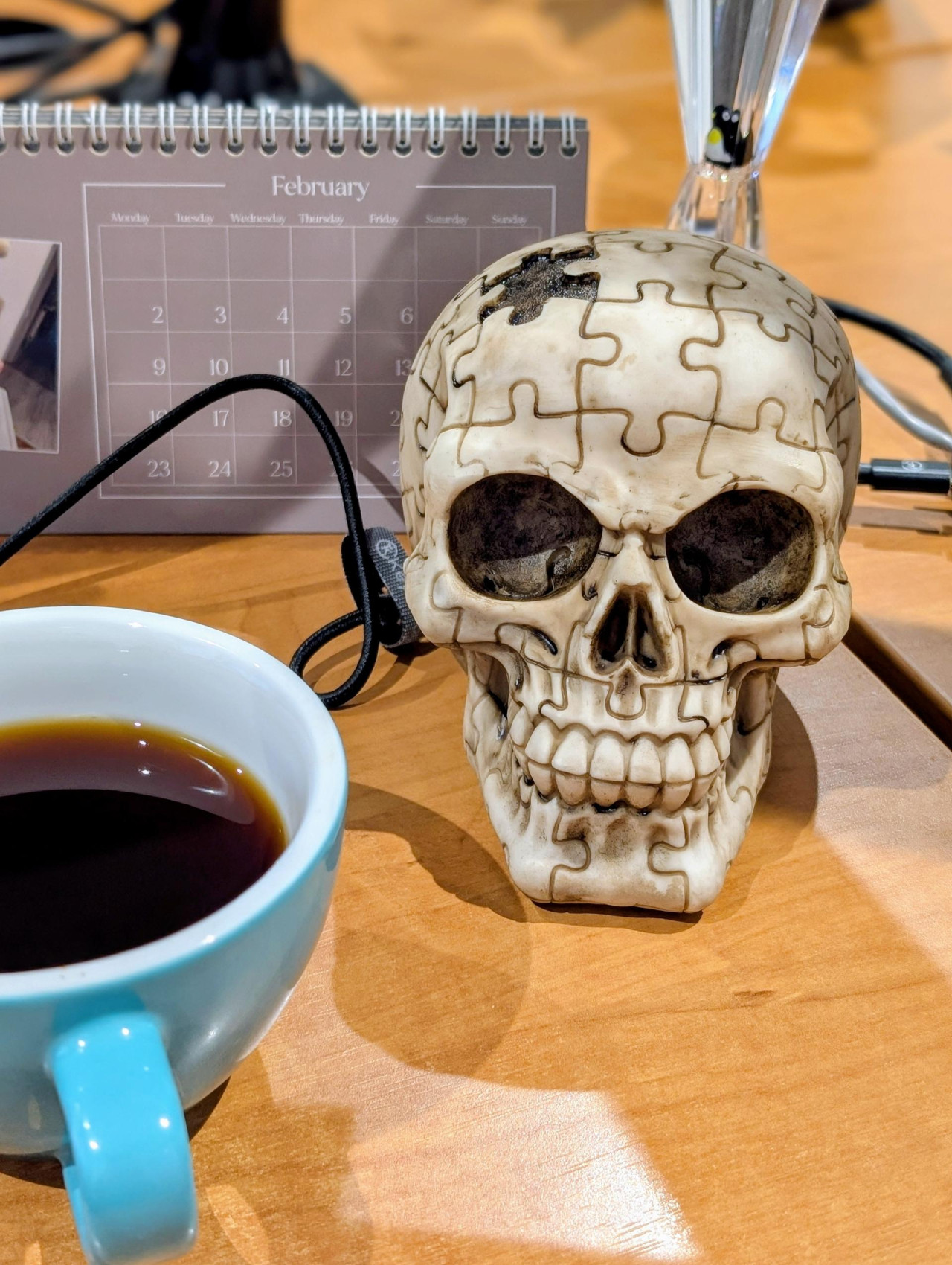 Photo of a fake skull engraved with a jigsaw pattern.