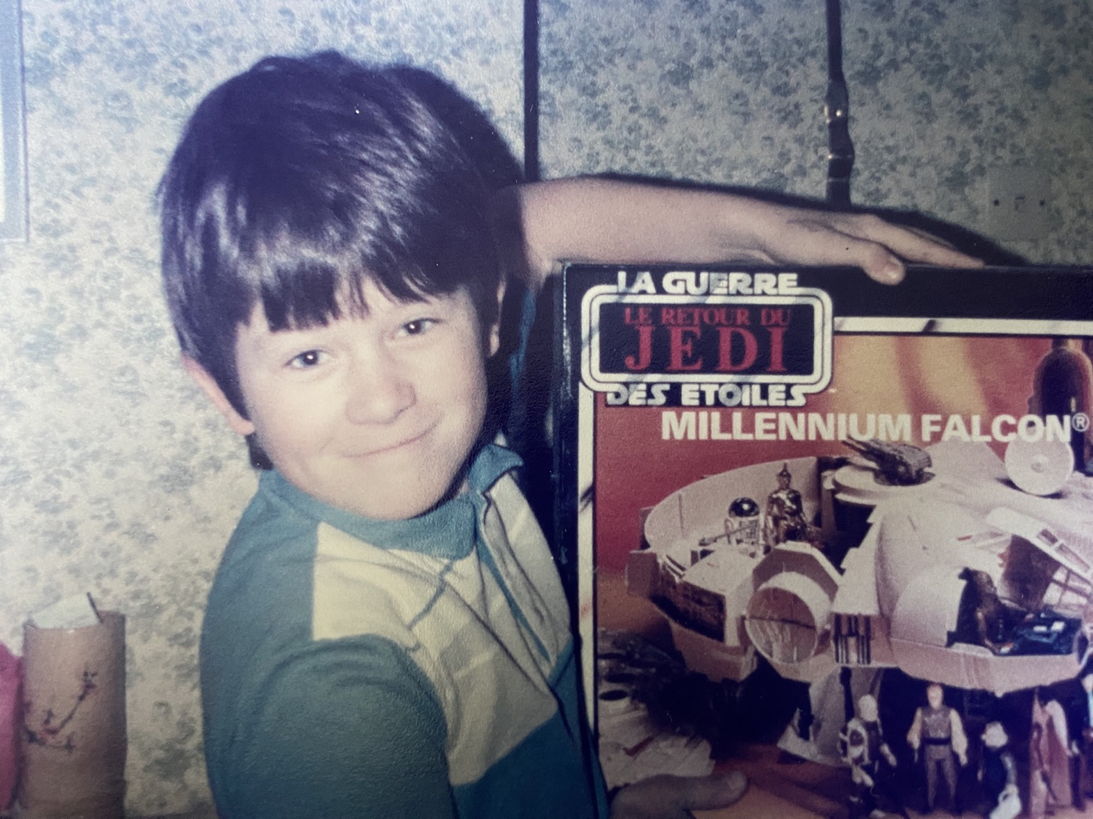 9 year old me at Christmas in 1984, proudly holding my Millennium Falcon.